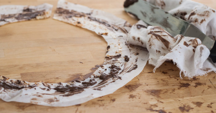 Learn how to keep your serving plate clean while frosting a cake. This simple trick uses items you already have on hand in your kitchen. From Flour Arrangements.