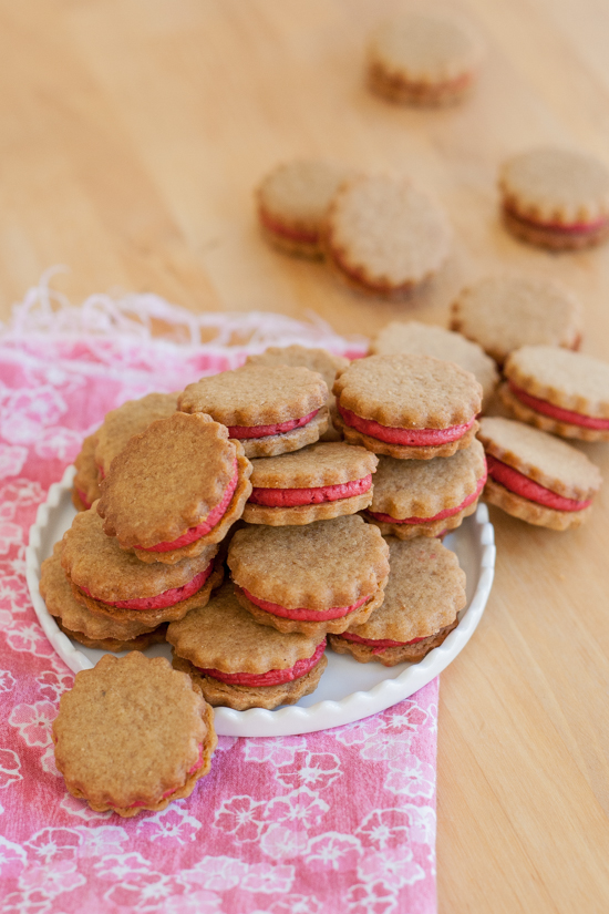 Gingerbread-Raspberry Sandwich Cookies combine two distinct, delicious flavors: spicy gingerbread cookies and tart raspberry filling.