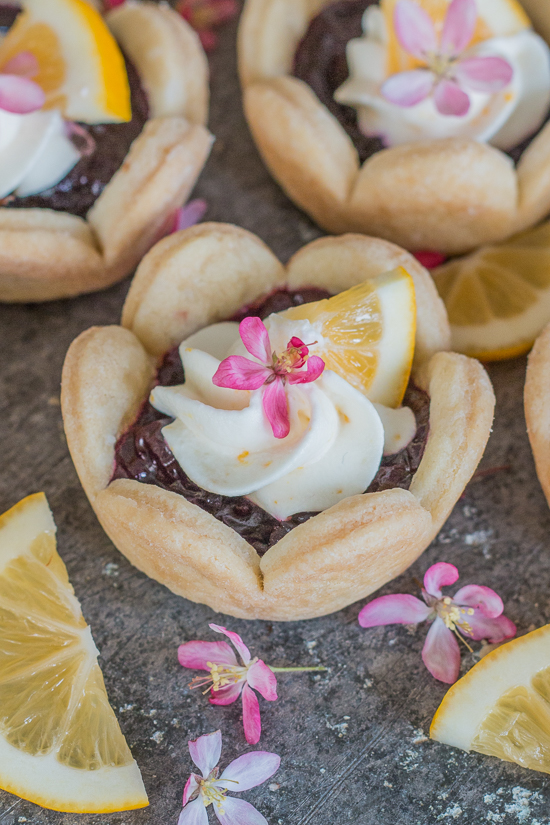 These adorable mini cherry pies are simple to serve and delicious to eat. Top with Meyer lemon cream for a burst of citrus flavor. A great recipe for parties!