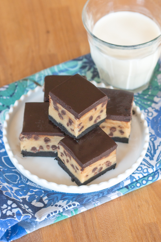 Rich chocolate chip cookie dough brownie bites combine three impossibly delicious layers of goodness. This decadent recipe features a thin, dense chocolate brownie topped with chocolate chip cookie dough smothered with chocolate ganache. 