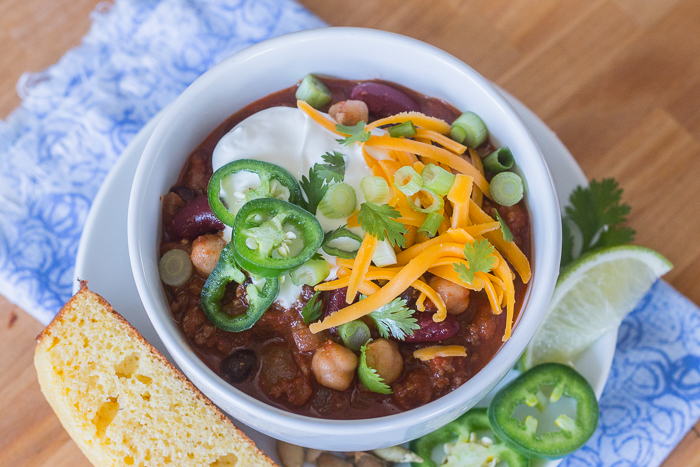 Bacon adds richness and smoked paprika imparts a deep, complex flavor to this easy Beef and Bean Chili. Serve it on its own or with rice, baked potatoes, or mac and cheese! This recipe produces a generous pot of chili, which makes it great for parties and leftovers.