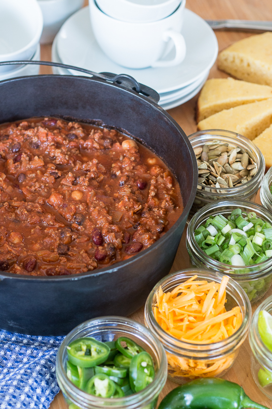 Bacon adds richness and smoked paprika imparts a deep, complex flavor to this easy Beef and Bean Chili. Serve it on its own or with rice, baked potatoes, or mac and cheese! This recipe produces a generous pot of chili, which makes it great for parties and leftovers.