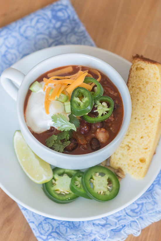 Bacon adds richness and smoked paprika imparts a deep, complex flavor to this easy Beef and Bean Chili. Serve it on its own or with rice, baked potatoes, or mac and cheese! This recipe produces a generous pot of chili, which makes it great for parties and leftovers.