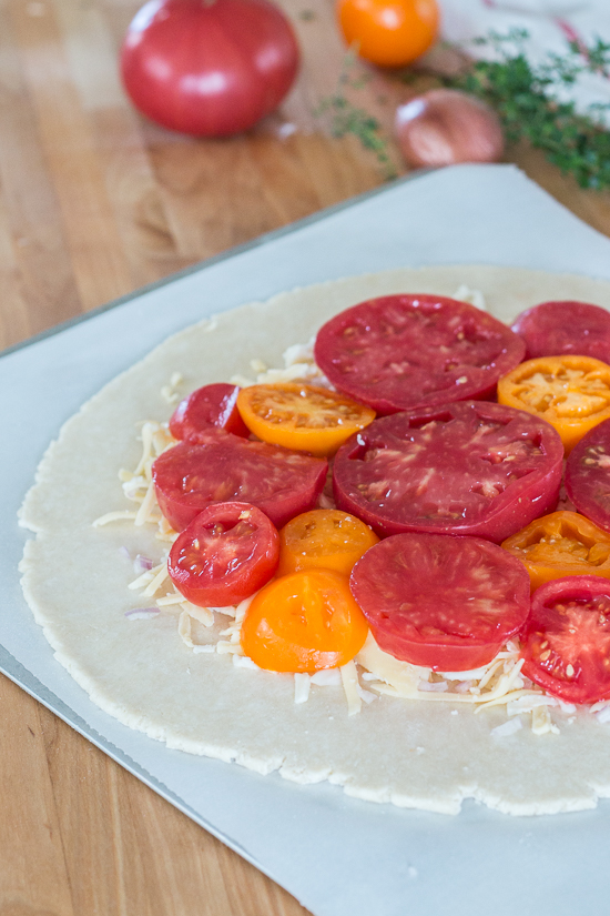 Simple yet stunning, this tomato galette turns juicy, ripe tomatoes into a satisfying, delicious meal. Gouda and smoked mozzarella provide a rich, slightly smoky backdrop to the bright tomato flavor.