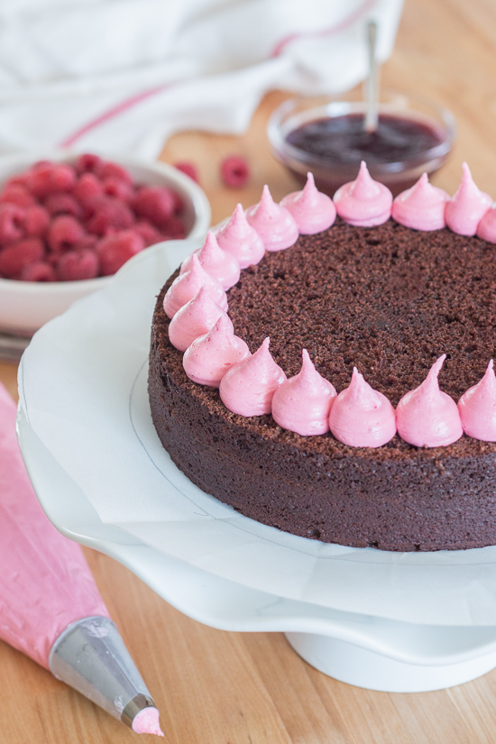 Simple and elegant, this raspberry chocolate layer cake blends rich, decadent chocolate with tart, sweet raspberries. Raspberry liqueur adds a fruity backdrop to the chocolate cake layers, while raspberry jam and raspberry buttercream add bright sweetness. 