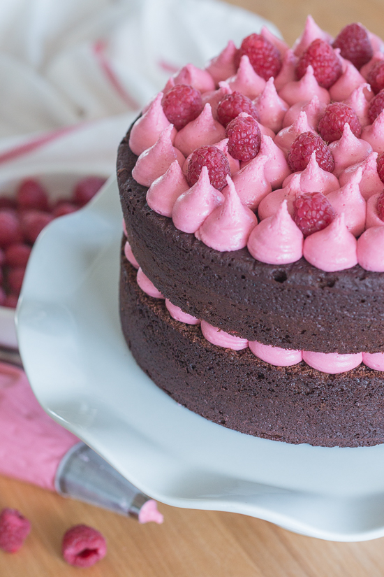 Simple and elegant, this raspberry chocolate layer cake blends rich, decadent chocolate with tart, sweet raspberries. Raspberry liqueur adds a fruity backdrop to the chocolate cake layers, while raspberry jam and raspberry buttercream add bright sweetness. 