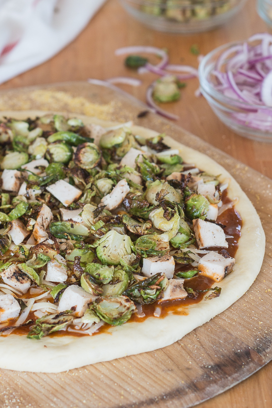 Sweet, tangy barbecue sauce provides a flavorful, fun twist to homemade pizza. Topped with cooked chicken, roasted Brussels sprouts, red onion and Gruyere cheese, this simple barbecue pizza tastes totally gourmet!