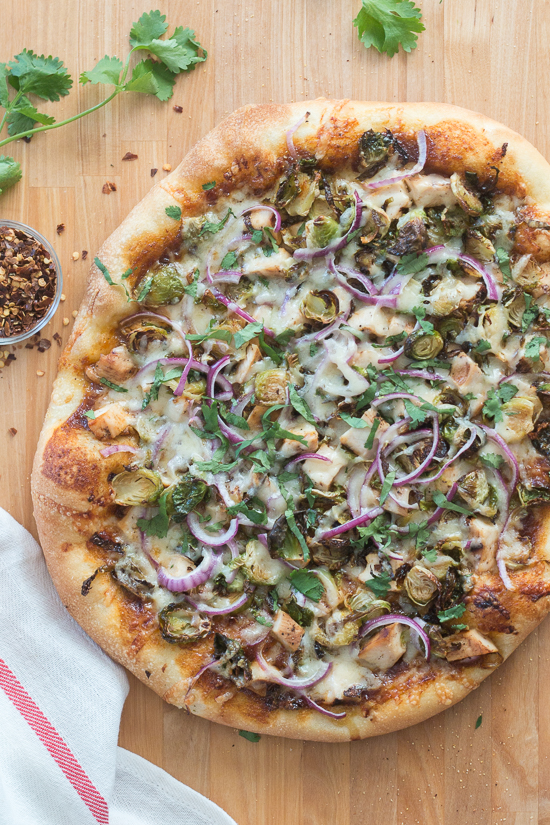 Sweet, tangy barbecue sauce provides a flavorful, fun twist to homemade pizza. Topped with cooked chicken, roasted Brussels sprouts, red onion and Gruyere cheese, this simple barbecue pizza tastes totally gourmet!