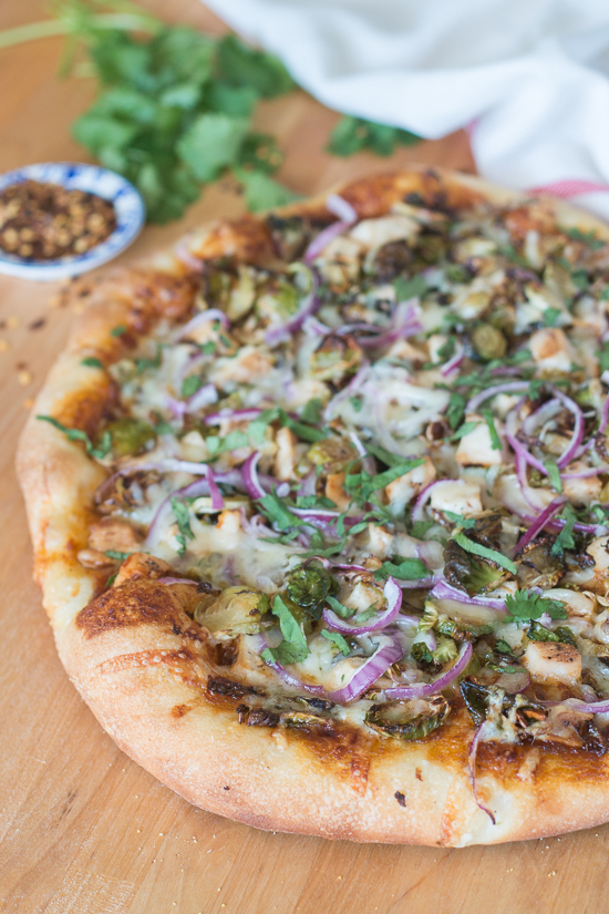 Sweet, tangy barbecue sauce provides a flavorful, fun twist to homemade pizza. Topped with cooked chicken, roasted Brussels sprouts, red onion and Gruyere cheese, this simple barbecue pizza tastes totally gourmet!