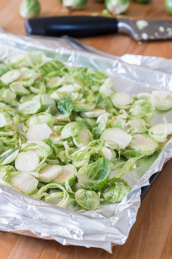 Sweet, tangy barbecue sauce provides a flavorful, fun twist to homemade pizza. Topped with cooked chicken, roasted Brussels sprouts, red onion and Gruyere cheese, this simple barbecue pizza tastes totally gourmet!