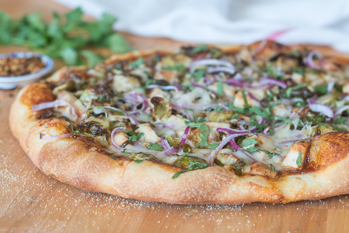 Sweet, tangy barbecue sauce provides a flavorful, fun twist to homemade pizza. Topped with cooked chicken, roasted Brussels sprouts, red onion and Gruyere cheese, this simple barbecue pizza tastes totally gourmet!