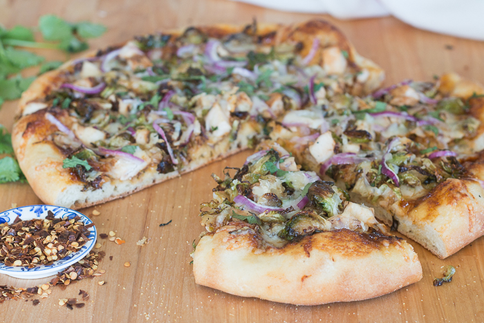 Sweet, tangy barbecue sauce provides a flavorful, fun twist to homemade pizza. Topped with cooked chicken, roasted Brussels sprouts, red onion and Gruyere cheese, this simple barbecue pizza tastes totally gourmet!