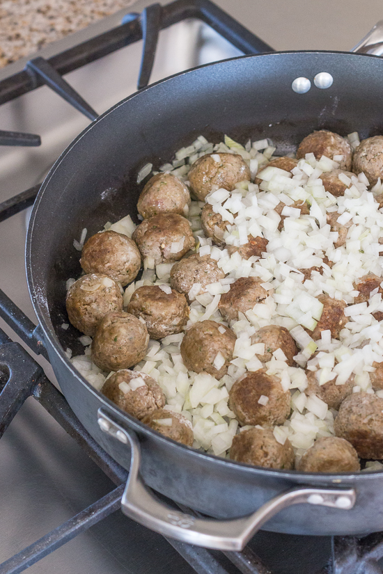 Ladled over spaghetti, these classic meatballs with simple tomato sauce epitomize hearty comfort food. Serve a crowd with this generous recipe or hoard the leftovers for easy meal planning.