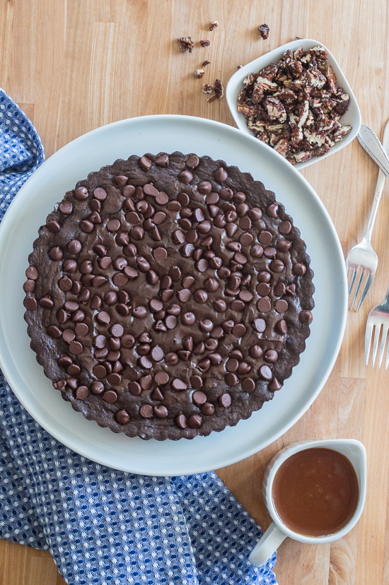 Give decadent chocolate brownies an elegant flair by swapping out a traditional square pan for a fluted tart pan. Top wedges of brownie tart with vanilla ice cream, homemade caramel sauce, and cinnamon pecans to create a sophisticated brownie sundae. 