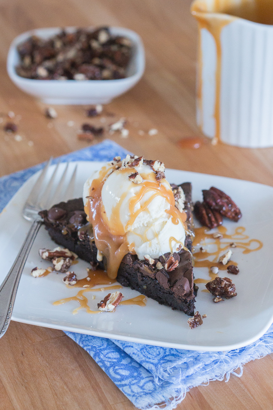 Give decadent chocolate brownies an elegant flair by swapping out a traditional square pan for a fluted tart pan. Top wedges of brownie tart with vanilla ice cream, homemade caramel sauce, and cinnamon pecans to create a sophisticated brownie sundae. 
