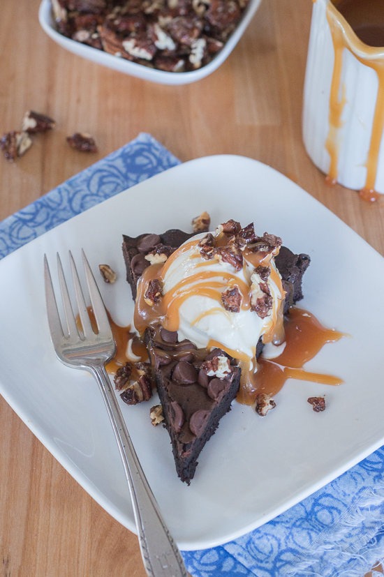 Give decadent chocolate brownies an elegant flair by swapping out a traditional square pan for a fluted tart pan. Top wedges of brownie tart with vanilla ice cream, homemade caramel sauce, and cinnamon pecans to create a sophisticated brownie sundae. 