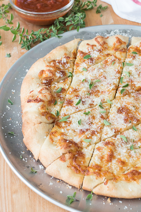 With a small bowl of marinara sauce for dipping, these cheesy, garlicky pizza chips make a fun party appetizer. A perfect recipe for Super Bowl Sunday!