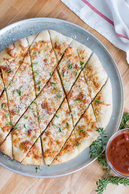 With a small bowl of marinara sauce for dipping, these cheesy, garlicky pizza chips make a fun party appetizer. A perfect recipe for Super Bowl Sunday!