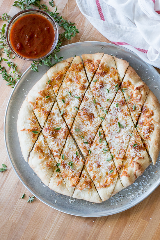 With a small bowl of marinara sauce for dipping, these cheesy, garlicky pizza chips make a fun party appetizer. A perfect recipe for Super Bowl Sunday!