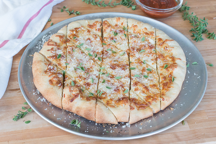 With a small bowl of marinara sauce for dipping, these cheesy, garlicky pizza chips make a fun party appetizer. A perfect recipe for Super Bowl Sunday!