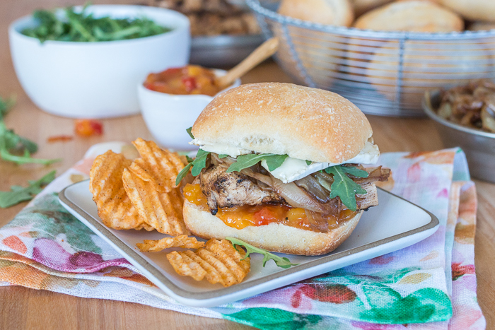 These Grilled Chicken and Brie Sandwiches with Mango Chutney and Balsamic Onions make a perfect meal or party dish! Ciabatta, with its chewy open texture, offers up plenty of nooks and crannies to capture the rich, creamy Brie, tangy mango chutney, and tender balsamic onions.