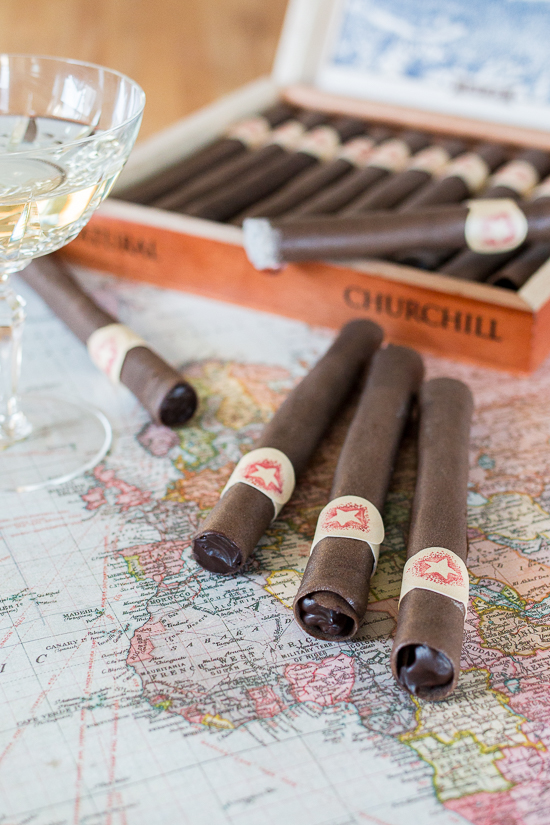 These Chocolate Tuile Cigars with Whisky Ganache feature wafer-thin chocolate cookies loaded with boozy chocolate. This truly decadent treat provides a sweet alternative to the idea of celebratory cigars!