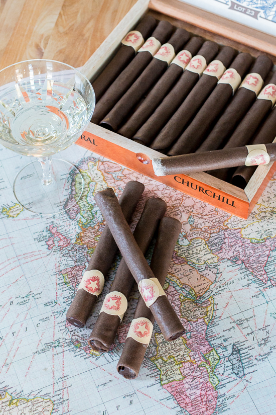 These Chocolate Tuile Cigars with Whisky Ganache feature wafer-thin chocolate cookies loaded with boozy chocolate. This truly decadent treat provides a sweet alternative to the idea of celebratory cigars!