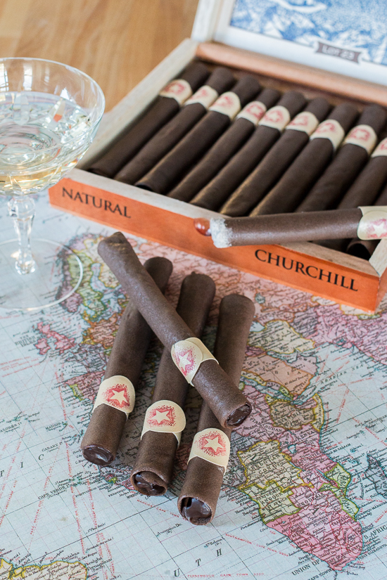 These Chocolate Tuile Cigars with Whisky Ganache feature wafer-thin chocolate cookies loaded with boozy chocolate. This truly decadent treat provides a sweet alternative to the idea of celebratory cigars!