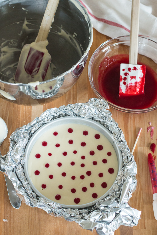 Smooth and indulgent, this Vanilla Raspberry Cheesecake hides a surprise layer of tart raspberry filling in the center. Decorative heart embellishments add flair to this petite, delicious cheesecake. 