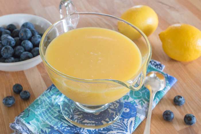 Tart and tangy, with a brilliant golden hue, this rich Hot Lemon Sauce adds bright color and zing to nearly any sweet treat. With only four ingredients -- sugar, a lemon, egg yolks, and butter -- this recipes is a breeze to prepare. #sauces #citrus #lemon #desserts