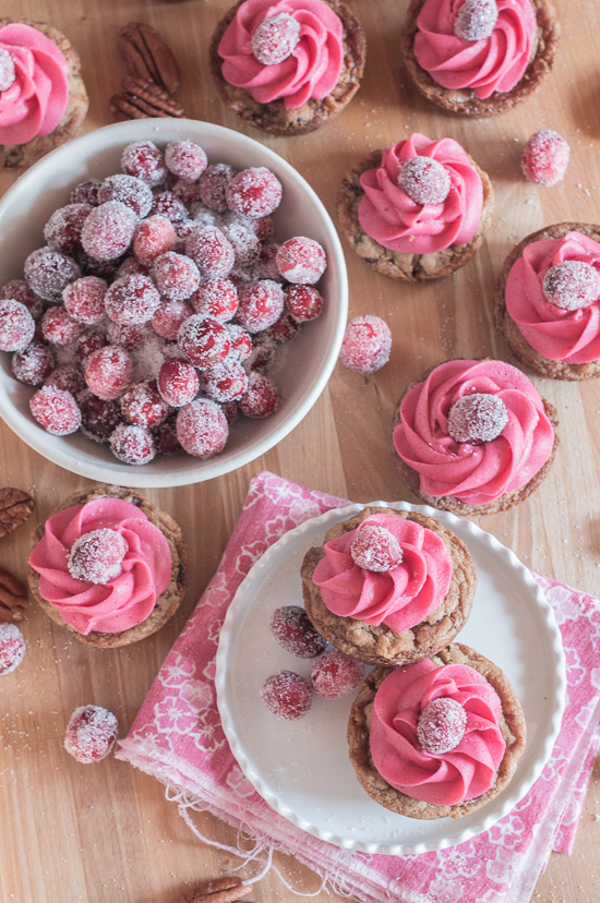 With their deep pink cranberry buttercream and glittery sugared cranberries, these pretty Muffin Tin Cranberry-Pecan Blondies make a great, easy-to-serve dessert for festive occasions.