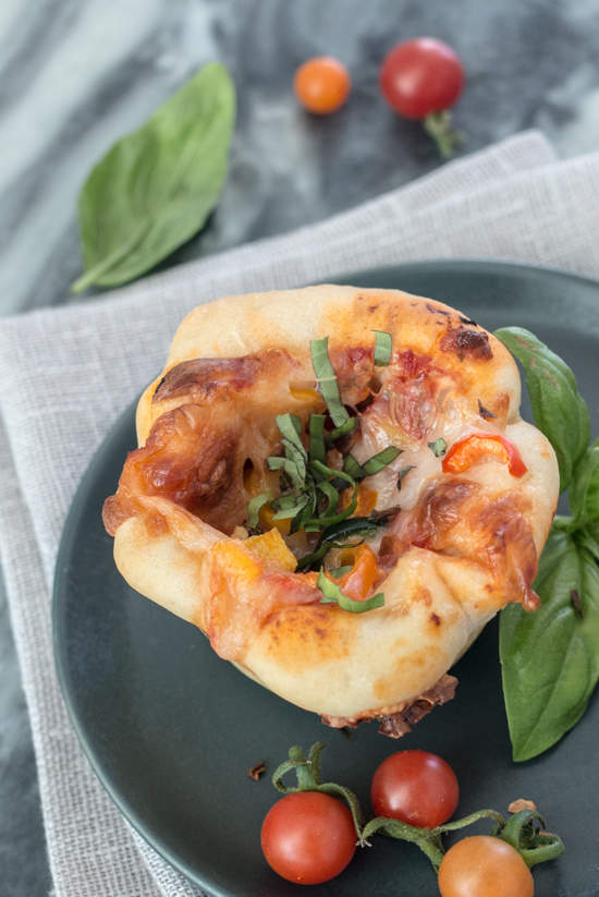 These Mini Deep Dish Pizzas deliver big flavor in adorable muffin-sized packaging. Loaded with mozzarella cheese, flavorful tomato sauce, and tasty fillings, these petite pizzas make a satisfying, easy-to-prepare meal.