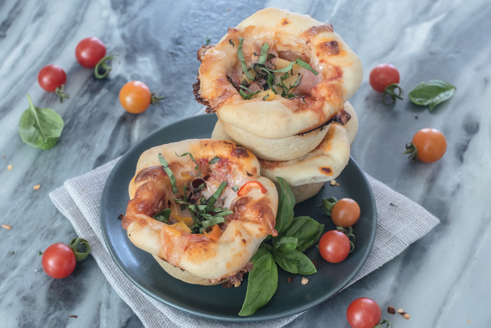These Mini Deep Dish Pizzas deliver big flavor in adorable muffin-sized packaging. Loaded with mozzarella cheese, flavorful tomato sauce, and tasty fillings, these petite pizzas make a satisfying, easy-to-prepare meal.