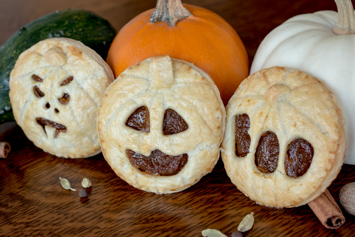 Perfect for Halloween, these adorable Jack-O'-Lantern Pumpkin Hand Pies feature a velvety-smooth pumpkin filling tucked between layers of rich, flaky pastry. 