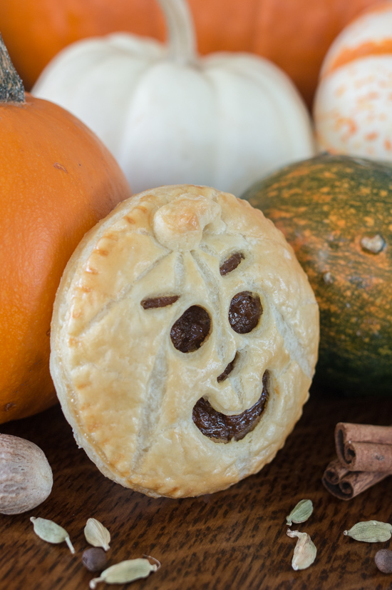 Perfect for Halloween, these adorable Jack-O'-Lantern Pumpkin Hand Pies feature a velvety-smooth pumpkin filling tucked between layers of rich, flaky pastry. 