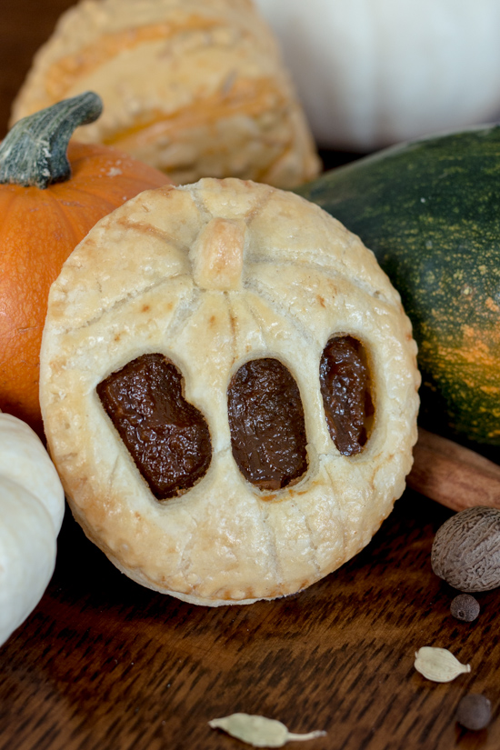 Perfect for Halloween, these adorable Jack-O'-Lantern Pumpkin Hand Pies feature a velvety-smooth pumpkin filling tucked between layers of rich, flaky pastry. 