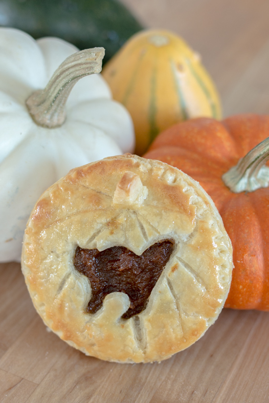 Perfect for Halloween, these adorable Jack-O'-Lantern Pumpkin Hand Pies feature a velvety-smooth pumpkin filling tucked between layers of rich, flaky pastry. 