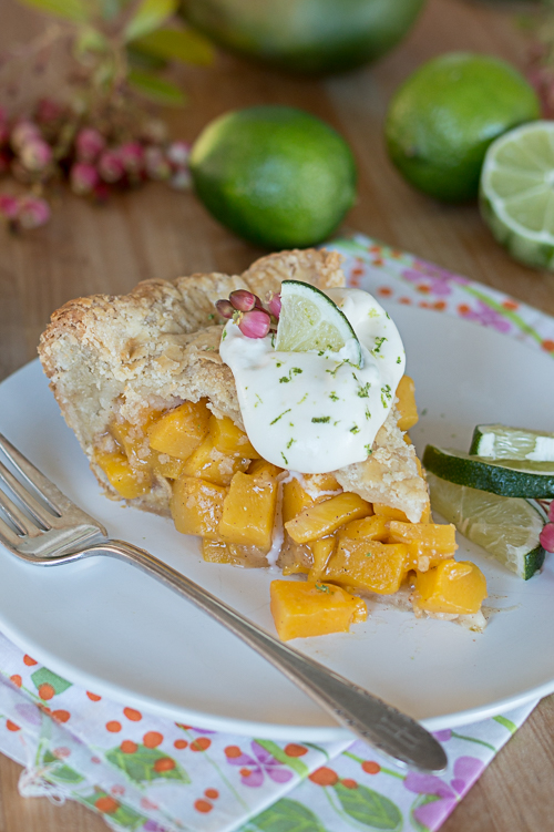 Mango Pie topped with Lime Whipped Cream delivers vibrant, tropical flavors in a delightfully flaky pastry packaging.  