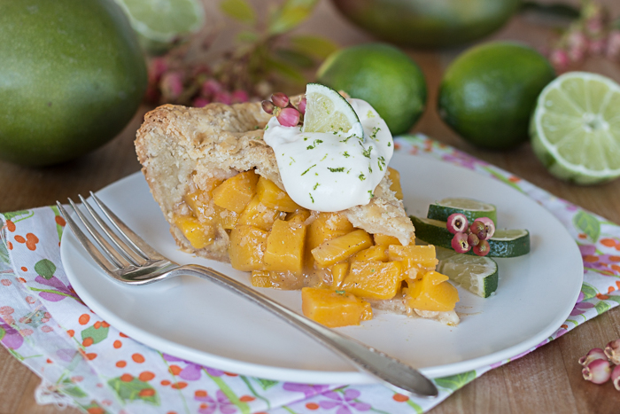 Mango Pie topped with Lime Whipped Cream delivers vibrant, tropical flavors in a delightfully flaky pastry packaging.  