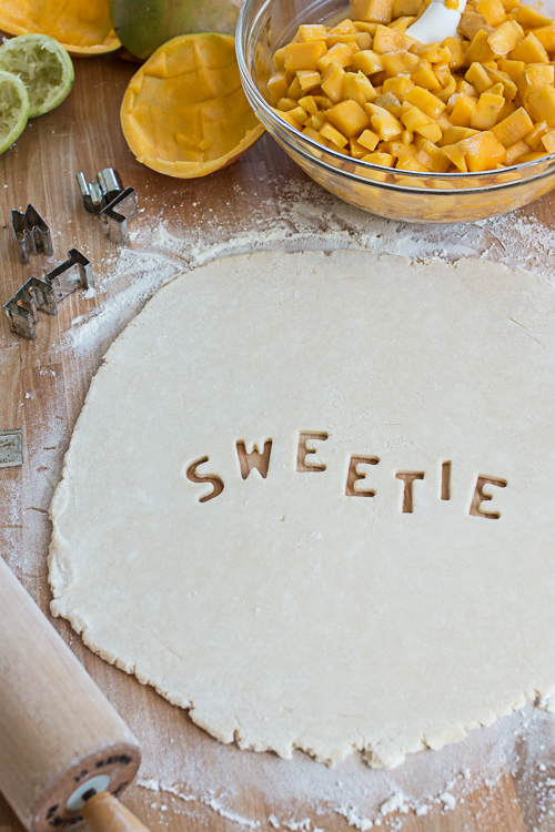 Mango Pie topped with Lime Whipped Cream delivers vibrant, tropical flavors in a delightfully flaky pastry packaging.  