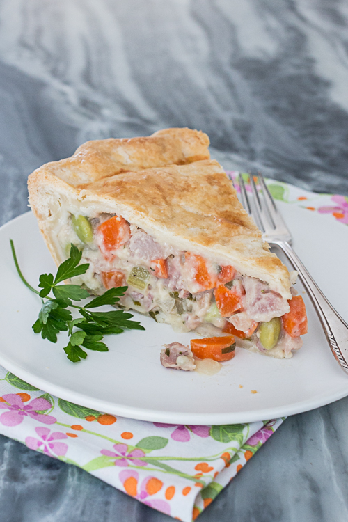 This Ham Pot Pie wraps up flavorful, smoky ham and plenty of vegetables in a flaky, buttery pastry to deliver comfort food at its best. 