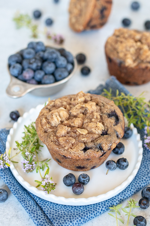 Sweet, tart blueberries add fruity flavor to these warm and satisfying Spiced Blueberry Muffins. A ginger-streusel topping adds texture and pizzazz! 