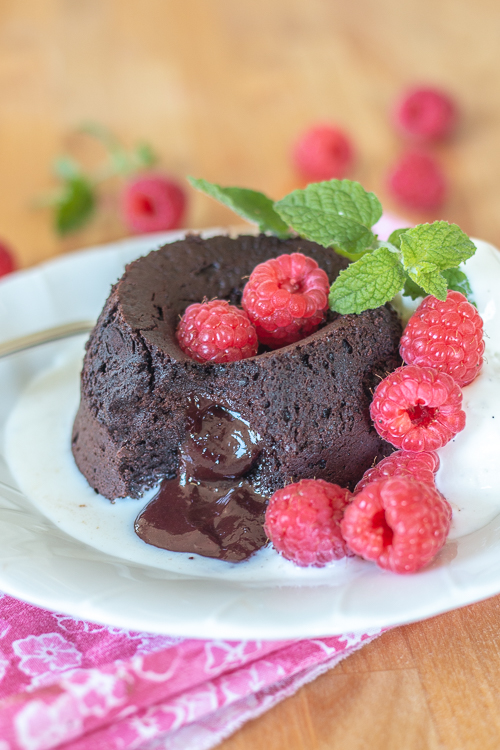 Elegant and indulgent, these foolproof Molten Chocolate-Raspberry Cakes have raspberry ganache tucked inside, which melts into warm, luscious perfection as they bake.  