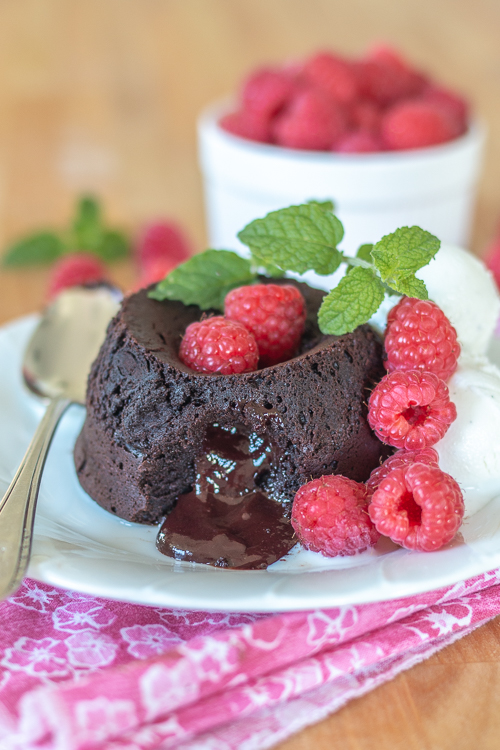 Elegant and indulgent, these foolproof Molten Chocolate-Raspberry Cakes have raspberry ganache tucked inside, which melts into warm, luscious perfection as they bake.  