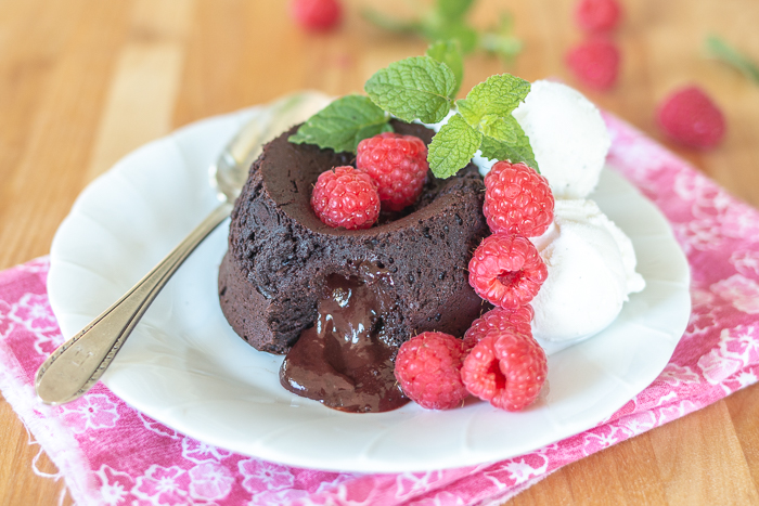 Elegant and indulgent, these foolproof Molten Chocolate-Raspberry Cakes have raspberry ganache tucked inside, which melts into warm, luscious perfection as they bake.  