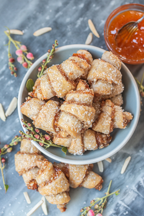 Tender, flaky cream cheese pastry provides the perfect vehicle for apricot jam and sweet almond filling in these Apricot-Almond Rugelach.
