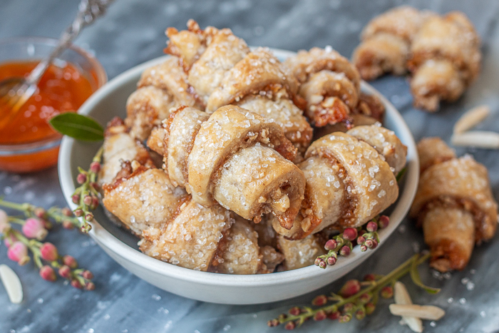 Tender, flaky cream cheese pastry provides the perfect vehicle for apricot jam and sweet almond filling in these Apricot-Almond Rugelach.