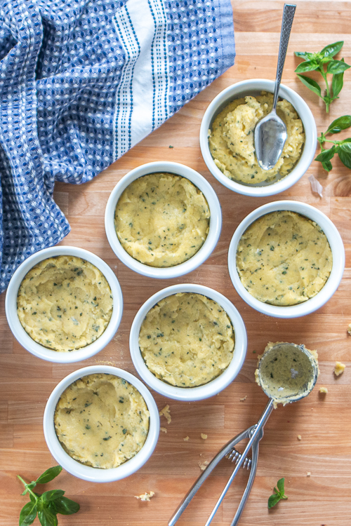 Comforting and delicious, these Easy Baked Polenta Cups feature a thick layer of polenta mounded with rich cheese, chopped vegetables and diced meats. With endless topping choices, this customizable recipe makes a perfect dinner bar meal. 