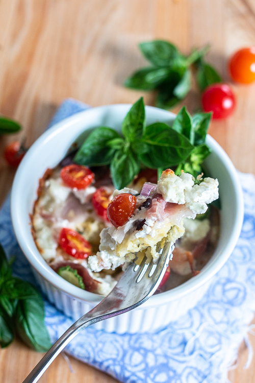 Comforting and delicious, these Easy Baked Polenta Cups feature a thick layer of polenta mounded with rich cheese, chopped vegetables and diced meats. With endless topping choices, this customizable recipe makes a perfect dinner bar meal. 