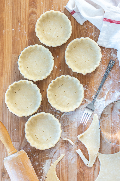 Chilling the tart shells before filling them helps them keep their shape during baking. 